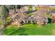 Inviting single story home featuring a manicured lawn and back patio perfect for outdoor relaxation and entertaining at 16 Wedge Way, Littleton, CO 80123