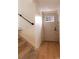 Lower level entry with stairs and wood-look flooring at 860 S Quivas St, Denver, CO 80223