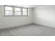 Spacious basement room with neutral carpeting and wainscoting at 860 S Quivas St, Denver, CO 80223