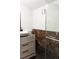 Modern bathroom with marble tile and glass shower at 860 S Quivas St, Denver, CO 80223