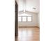 Bright bedroom with hardwood floors and large windows at 860 S Quivas St, Denver, CO 80223