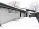 Rear exterior view showing gray siding and snow at 860 S Quivas St, Denver, CO 80223