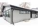 Gray house exterior with black accents, snow-covered yard at 860 S Quivas St, Denver, CO 80223