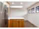 Modern kitchen with light wood cabinets and white countertops at 860 S Quivas St, Denver, CO 80223