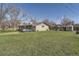 Charming single-story home featuring a well-maintained lawn and mature trees, perfect for outdoor enjoyment at 10150 W 25Th Ave, Lakewood, CO 80215