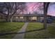 Charming home featuring a welcoming front porch and well-manicured lawn, perfect for relaxing evenings at 10150 W 25Th Ave, Lakewood, CO 80215