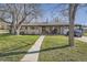 Charming home featuring a welcoming front porch and well-manicured lawn, perfect for relaxing evenings at 10150 W 25Th Ave, Lakewood, CO 80215