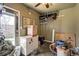 Garage featuring a freezer, shelves, and various storage containers, providing ample space at 10150 W 25Th Ave, Lakewood, CO 80215