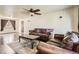 Living room with hardwood floors, ceiling fan, and leather furniture at 10150 W 25Th Ave, Lakewood, CO 80215