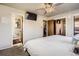 Main bedroom features an ensuite bathroom, walk-in closet, and television at 10150 W 25Th Ave, Lakewood, CO 80215