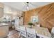 Cozy dining area features an accent wall and a view into the kitchen, great for Gathering meals at 1272 S Uvalda St, Aurora, CO 80012