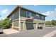 Multi-Gathering unit with a private balcony, attached garages, and lush, green exterior at 1272 S Uvalda St, Aurora, CO 80012
