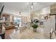 Bright and airy living room and dining area featuring wood floors and modern decor at 1272 S Uvalda St, Aurora, CO 80012
