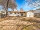 View of the backyard showing the layout of the home with a covered back porch at 2663 S Laredo St, Aurora, CO 80013