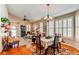 Open-concept dining room leading into the living room and kitchen area at 4322 N Meadows Dr, Castle Rock, CO 80109