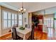 Elegant dining room with hardwood floors and natural light from the windows at 4322 N Meadows Dr, Castle Rock, CO 80109