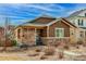 Beautiful single-Gathering home featuring stone accents and a cozy front porch at 4322 N Meadows Dr, Castle Rock, CO 80109