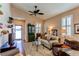 Comfortable living room with plush seating, ceiling fan, and natural light at 4322 N Meadows Dr, Castle Rock, CO 80109