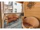 Relax on this cozy front porch with seating and a decorative outdoor space at 4322 N Meadows Dr, Castle Rock, CO 80109