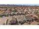 Neighborhood aerial view showcasing well-maintained homes, picturesque landscapes, and mountain views in the distance at 8390 S Cody Way, Littleton, CO 80128