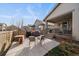 Backyard patio with stylish seating, a modern grill, and well-maintained landscaping, ideal for outdoor entertainment at 8390 S Cody Way, Littleton, CO 80128