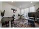 Functional home office with dual workstations, ergonomic chairs, and natural light creating an efficient workspace at 8390 S Cody Way, Littleton, CO 80128