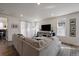 Comfortable living area with plush seating, recessed lighting, and easy access to adjacent rooms at 8390 S Cody Way, Littleton, CO 80128