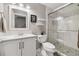 This bathroom boasts a sleek, glass-enclosed shower, updated sink and vanity with updated fixtures at 787 Huntington Pl, Highlands Ranch, CO 80126