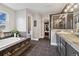 Modern main bathroom with a soaking tub, walk-in shower, dual sinks, and access to a walk-in closet at 787 Huntington Pl, Highlands Ranch, CO 80126