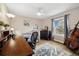 Bedroom with hardwood floors, a work desk, and a comfortable bed with stylish decor at 787 Huntington Pl, Highlands Ranch, CO 80126