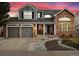 This home boasts a well-manicured front yard and 3-car garage at 787 Huntington Pl, Highlands Ranch, CO 80126