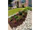 The front yard features lush landscaping and river rock accents at 787 Huntington Pl, Highlands Ranch, CO 80126