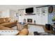 Comfortable living room with a fireplace, built-in bookshelves, and a large sofa, perfect for relaxation at 787 Huntington Pl, Highlands Ranch, CO 80126