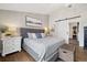 Comfortable main bedroom featuring stylish furnishings, hardwood floors, and a view into a walk-in closet at 787 Huntington Pl, Highlands Ranch, CO 80126