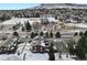 Aerial view of cozy townhomes with mountain backdrop and near a green space and playground at 14585 W 32Nd Ave, Golden, CO 80401