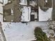 Overhead aerial view of rooftops with snowy backyard and a tree in winter at 14585 W 32Nd Ave, Golden, CO 80401