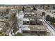 Aerial view featuring townhomes near a road, highlighting garages and parking at 14585 W 32Nd Ave, Golden, CO 80401