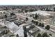 Aerial shot of townhomes, showcasing proximity to a road, garages and green space at 14585 W 32Nd Ave, Golden, CO 80401