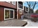 Rear view of a two-story home with a deck, patio doors, and minimal landscaping at 14585 W 32Nd Ave, Golden, CO 80401