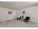 Finished basement with neutral carpet, two black chairs, decor, and a window at 14585 W 32Nd Ave, Golden, CO 80401