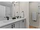 Bathroom featuring double sinks, sleek fixtures, and modern design for a spa-like experience at 14585 W 32Nd Ave, Golden, CO 80401