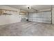 Spacious two-car garage with ample room for parking and storage on shelves at 14585 W 32Nd Ave, Golden, CO 80401