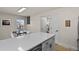 Bright, open kitchen with quartz counters, a dining nook, and white cabinetry for a clean, modern feel at 14585 W 32Nd Ave, Golden, CO 80401