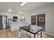 Well-lit kitchen with stainless steel appliances, island countertop and a dining area with great backyard views at 14585 W 32Nd Ave, Golden, CO 80401