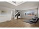 Spacious living room with an open staircase and big windows that bring in natural light at 14585 W 32Nd Ave, Golden, CO 80401