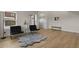 Bright living room with light wood floors, white walls, and large windows, creating an inviting space at 14585 W 32Nd Ave, Golden, CO 80401