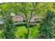 Aerial view of the house showcasing the well-maintained lawn and mature trees at 2237 Zinnia St, Golden, CO 80401