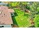 Expansive backyard featuring a lush green lawn, mature trees, and outdoor seating area at 2237 Zinnia St, Golden, CO 80401