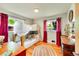 Fun bedroom featuring bunk beds, hardwood floors, natural light, and vibrant curtains at 2237 Zinnia St, Golden, CO 80401