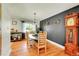 Elegant dining room with hardwood floors, stylish decor, and a vintage grandfather clock at 2237 Zinnia St, Golden, CO 80401